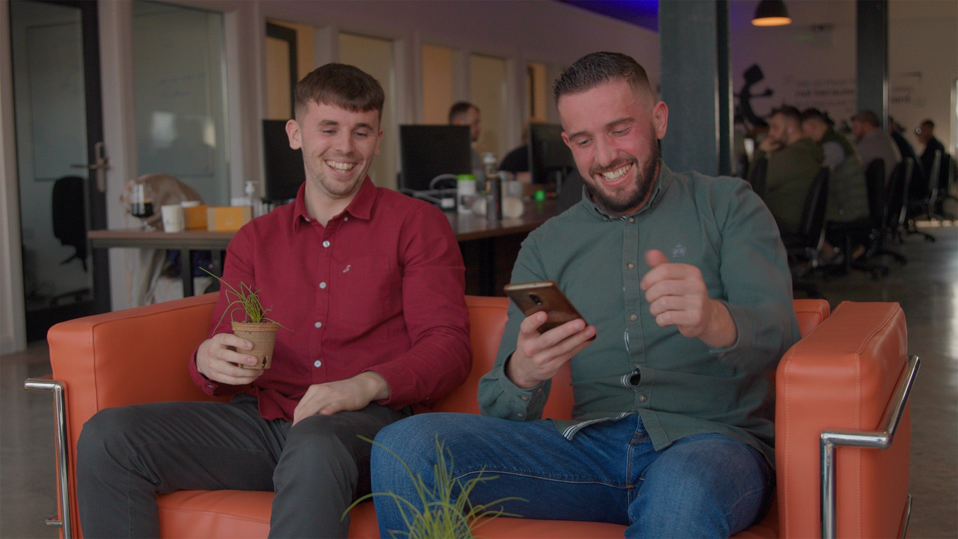 Two male employees take part in the Sow, Grow & Show