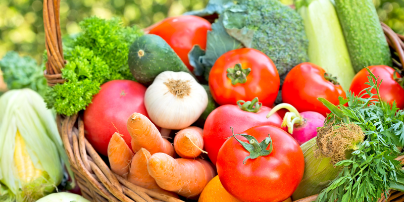 A small basket full of colourful vegetables