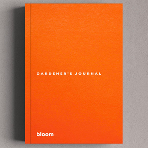 Orange garden journal on grey background