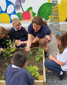 Mary Bishop, GIY Education coordinator showing worms to young school children 